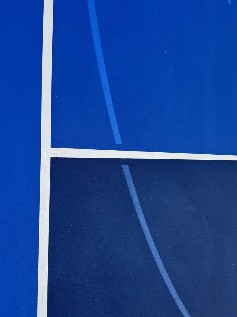 Abstract blue lines and shapes on a dark blue background.