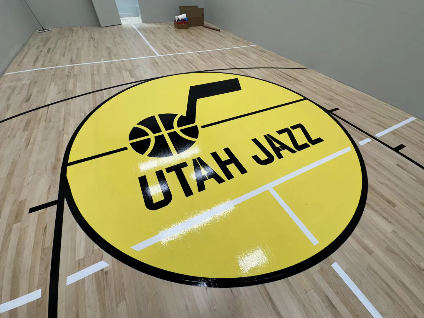 Utah Jazz logo on a newly finished basketball court.
