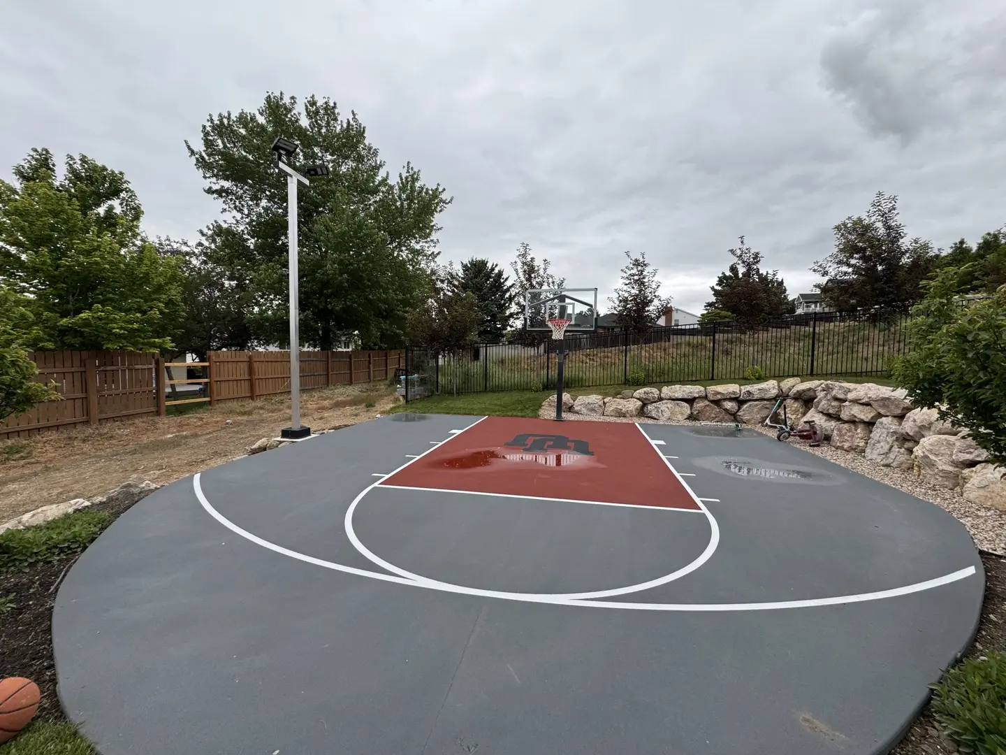 Custom basketball court with red key and logo