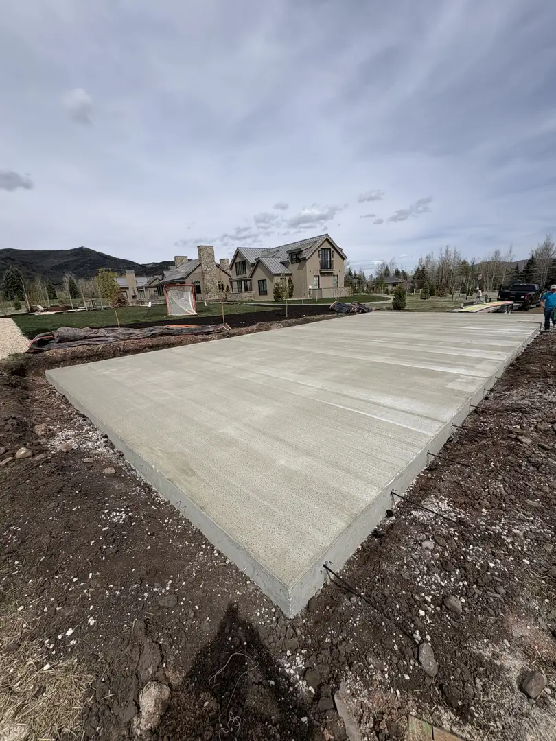 Freshly poured concrete foundation for a new home construction.