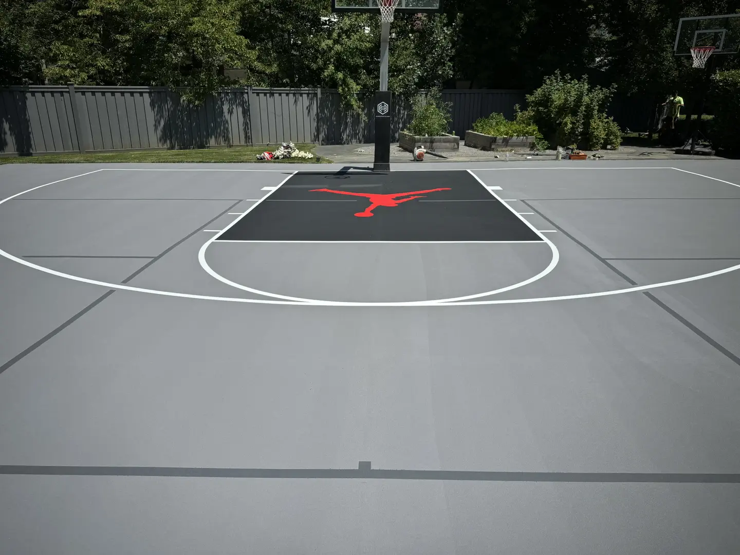 Custom basketball court with red Jordan logo